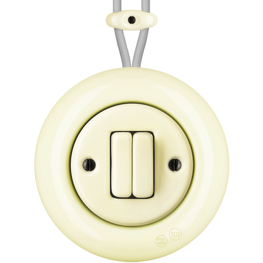 PORCELAIN KATY PATY COLONA ROUND SURFACE MOUNTED DOUBLE SLIM BUTTON SWITCH VANILLA - DYKE & DEAN