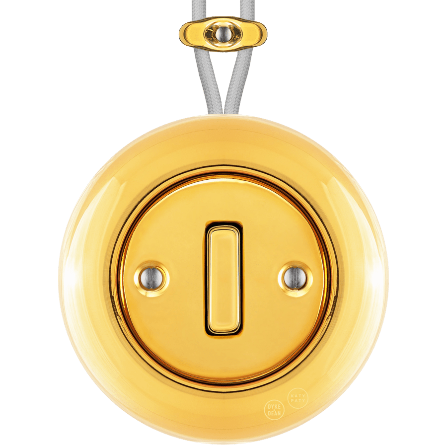 PORCELAIN KATY PATY COLONA ROUND SURFACE MOUNTED SLIM BUTTON SWITCH GOLD - DYKE & DEAN