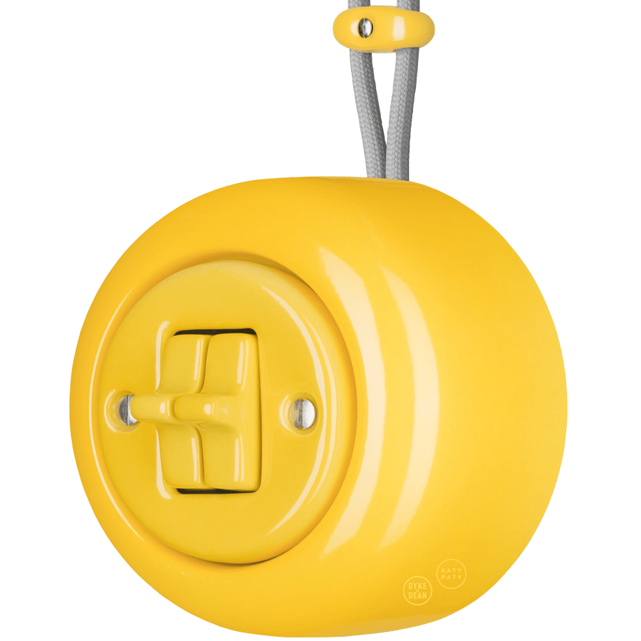 PORCELAIN ROUND SURFACE MOUNTED DOUBLE TOGGLE BUTTON SWITCH YELLOW - DYKE & DEAN
