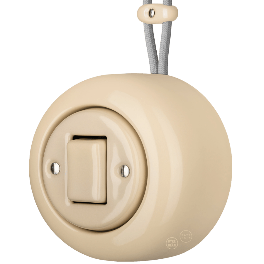 PORCELAIN ROUND SURFACE MOUNTED FAT BUTTON SWITCH SAND - DYKE & DEAN