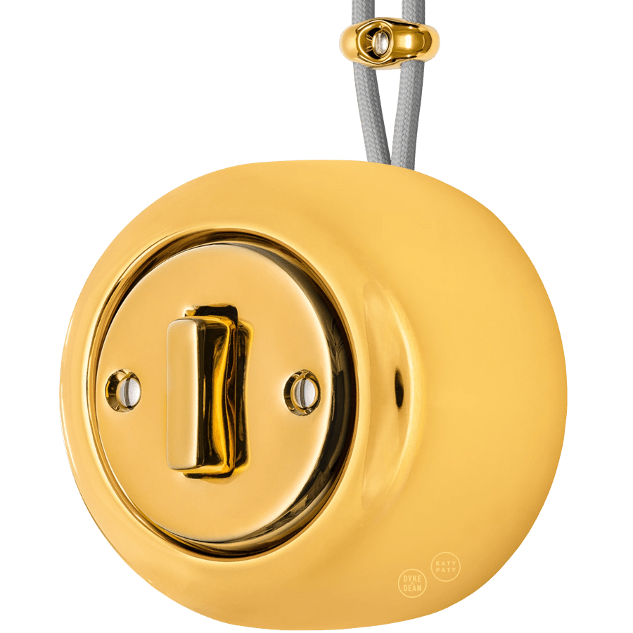 PORCELAIN ROUND SURFACE MOUNTED SLIM BUTTON SWITCH GOLD - DYKE & DEAN
